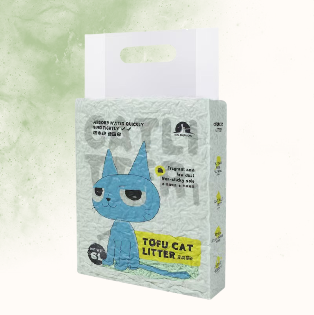 Package of tofu cat litter with a blue cartoon cat on a light green background