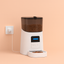 White and black pet feeder with food on a beige background