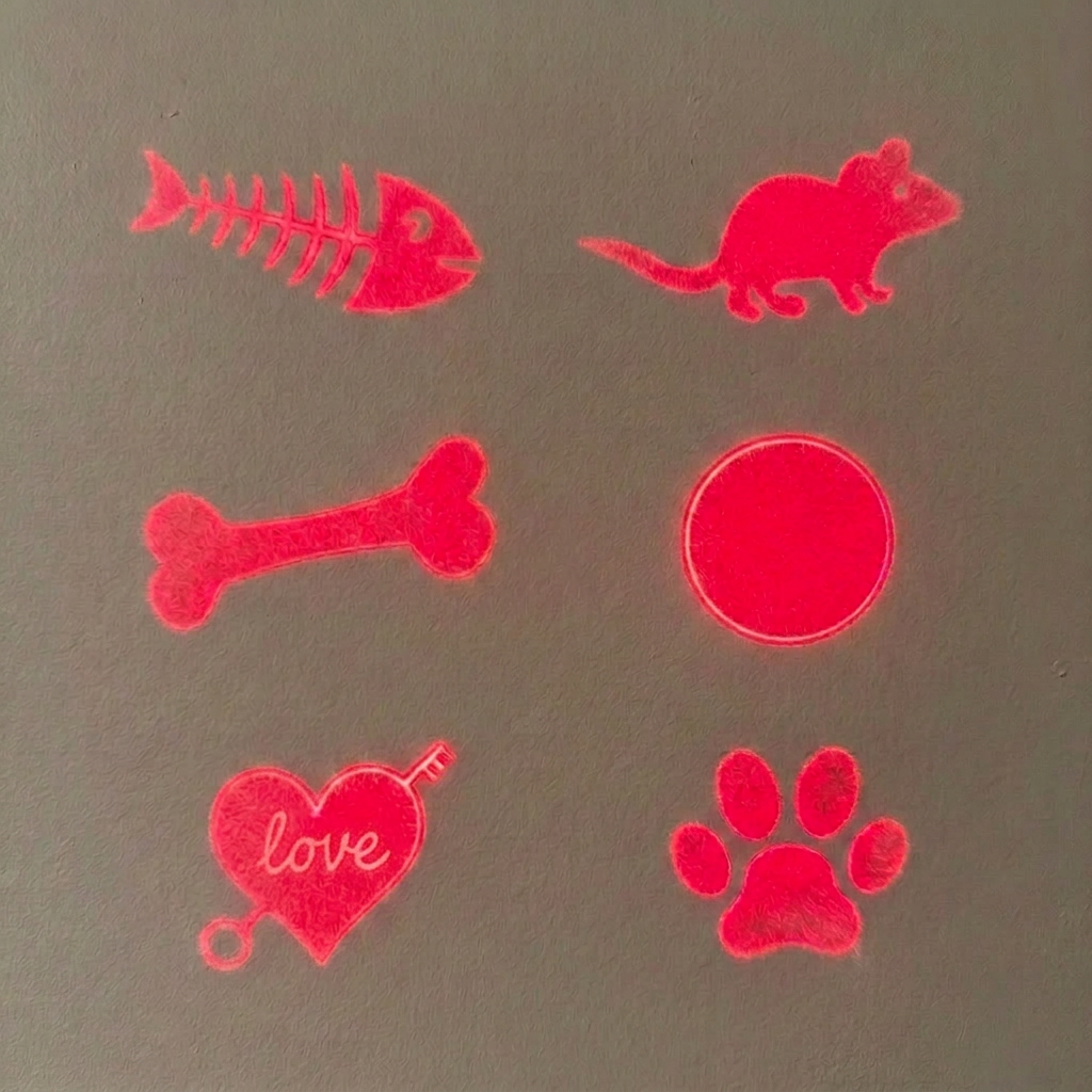 Six red laser-cut pet silhouette designs, including a fish skeleton, mouse, bone, circle, heart with the word 'love', and paw print, shown on a gray background.