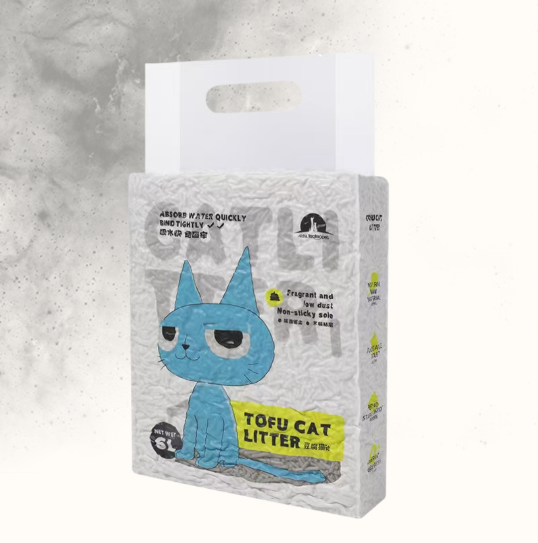 Package of tofu cat litter with a blue cartoon cat design on a gray background